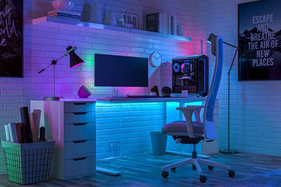 a small gaming room using most of the space with various equipment such as gaming chair, pc setup, and posters. a minimalistic approach is a good way on gaming room ideas for small rooms