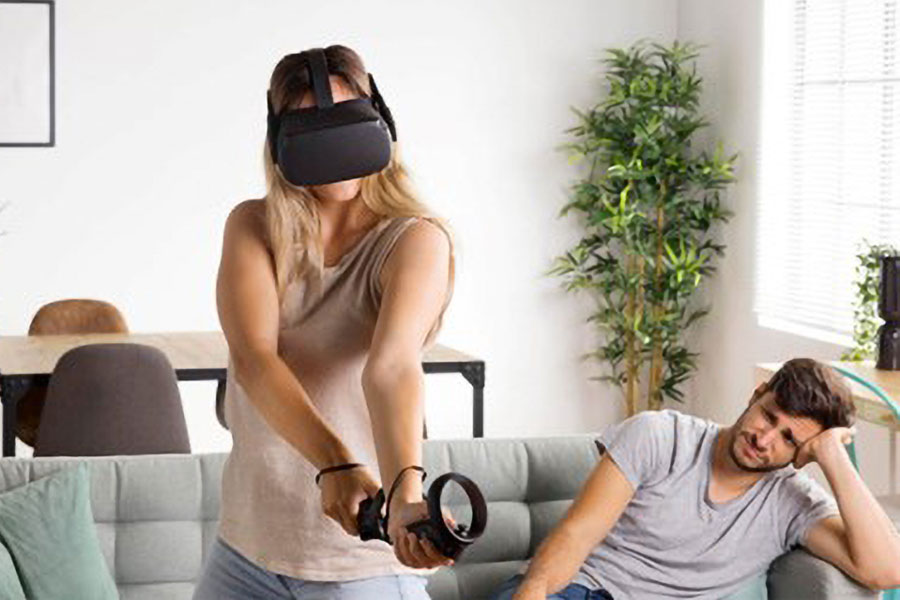 picture of a gamer wielding a sword with a VR Headset, doing exercises to burn calories while gaming.