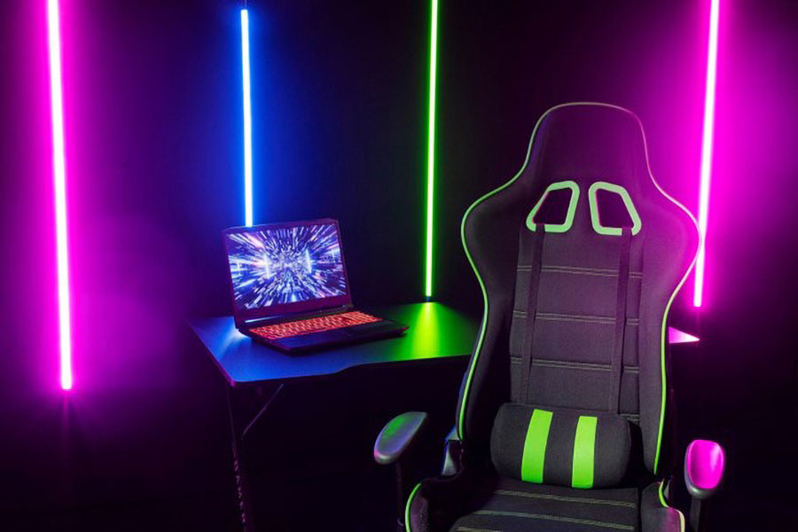 Picture of a Gaming Chair in front of a Laptop, One of equipment needed to start a gaming youtube channel.