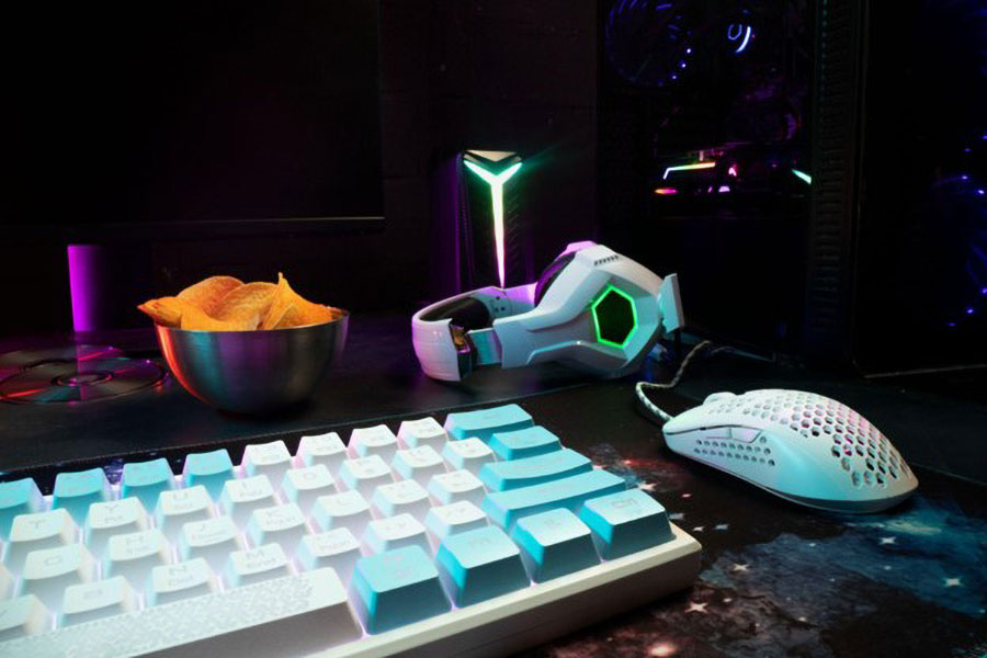 requirements to be a gamer include having proper gaming gear like the ones in the picture: a headphone, a mouse, a keyboard.