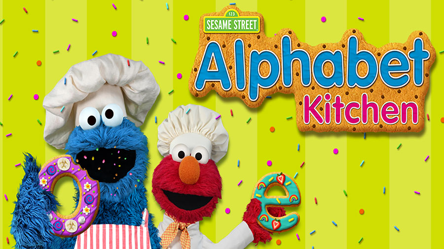 Screenshot of Sesame Street Alphabet Kitchen showing Cookie Monster and Elmo baking cookies.