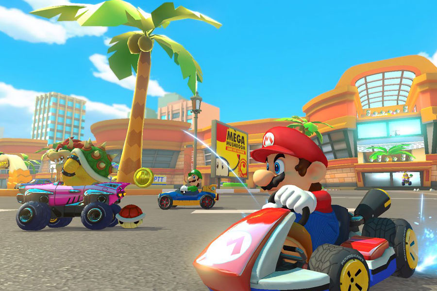 Characters racing on a colorful track in Mario Kart 8 Deluxe.