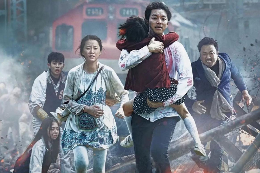 a picture of Train to Busan with its main characters, one of horror movies for gamers.