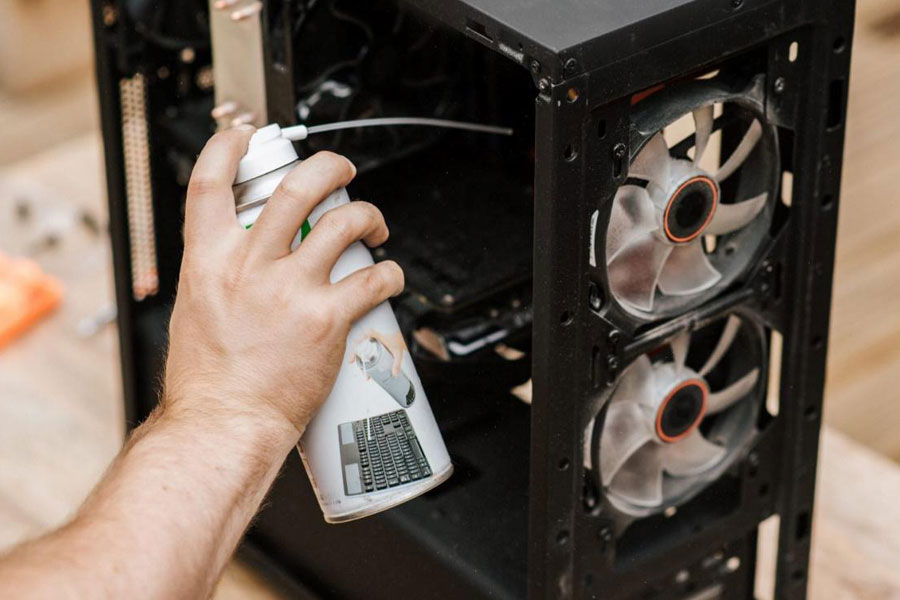 Picture of a Person Cleaning his PC, One of Ways on how to play high graphics game in low pc.