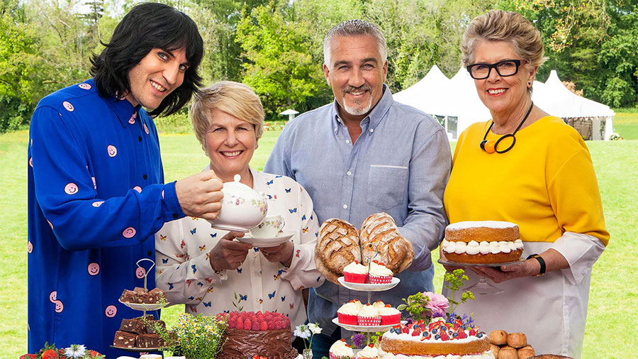 Contestants baking in The Great British Bake Off tent.