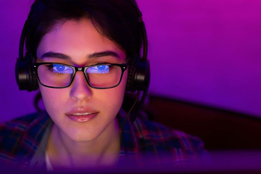 Image of a woman playing games while using glasses.