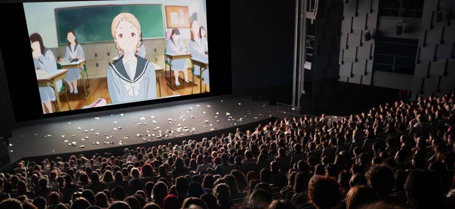 a hall full of people watching anime.