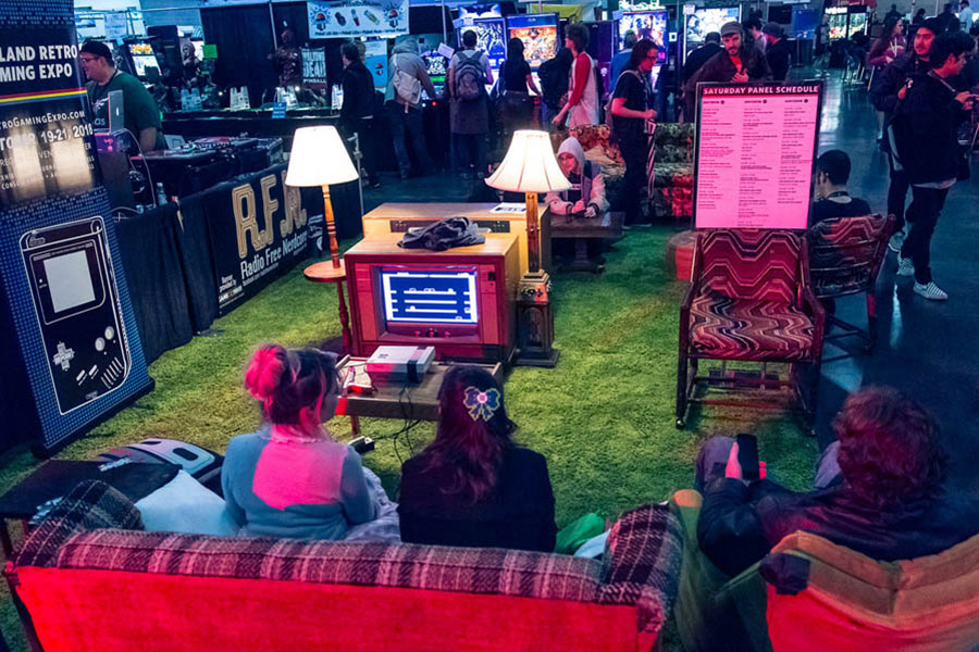 two girls playing video games in a hall of BIG Conference 2024