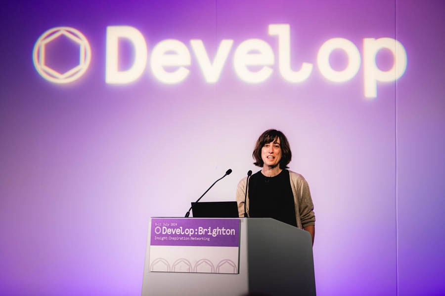 a woman giving speech on Develop Brighton 2025.