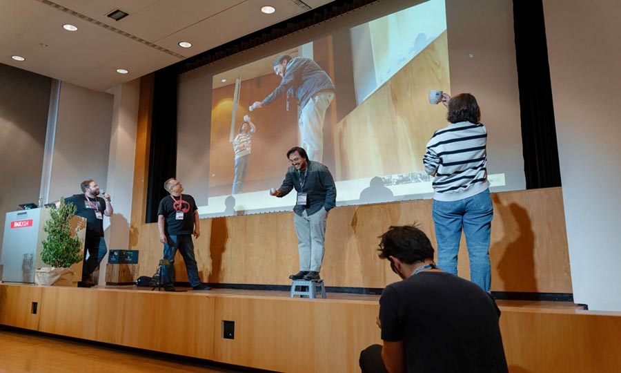 an image showing four people talking in a conference of FMX2025.