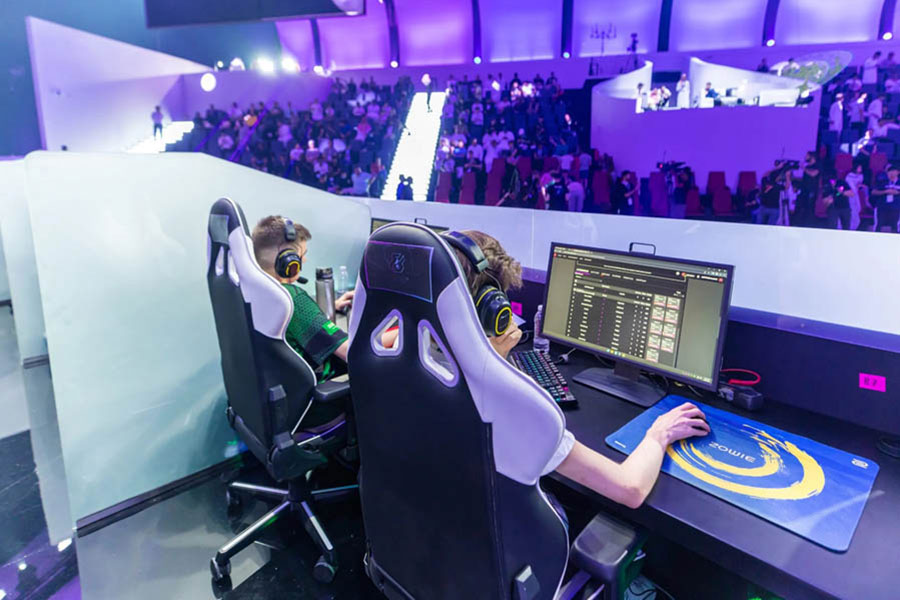 two boys working with computer in festival of HGC MENA 2024.