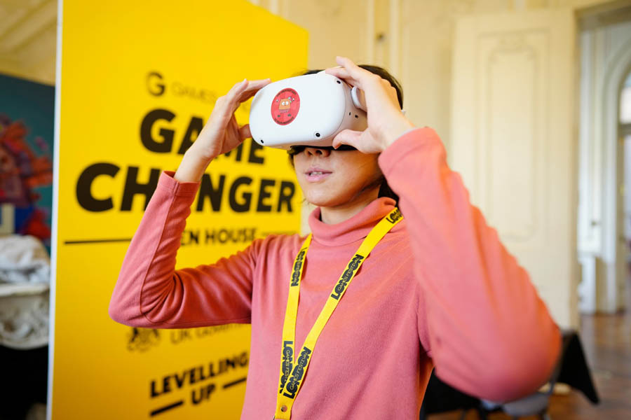 an excited girl playing with VR.