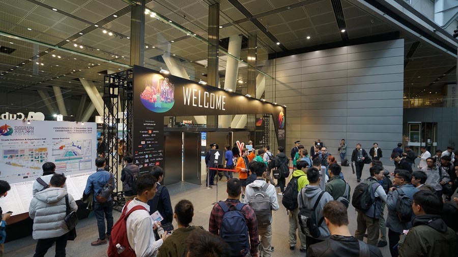 a hall with entry gate of SIGGRAPH Asia 2024 festival.