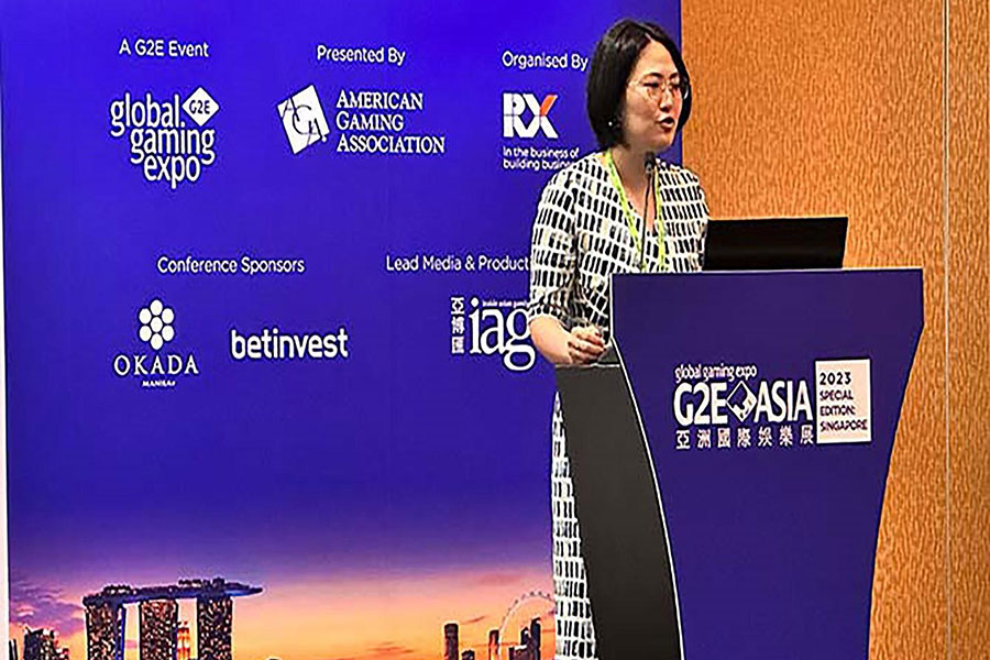 a female sponsor of G2E Asia 2025 on stage.