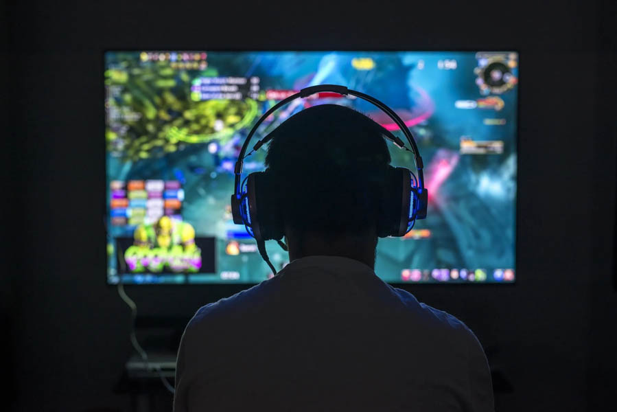 A wallpaper of a gamer playing.