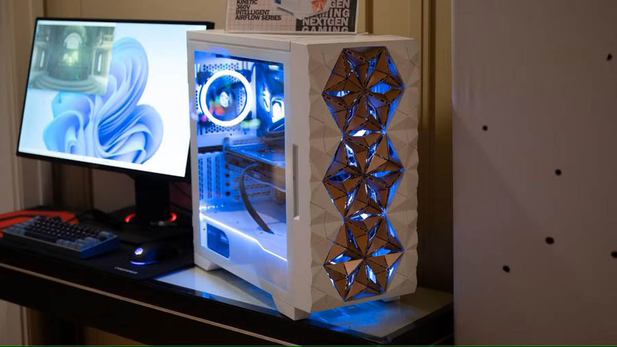 Image of a gaming setup and a white case that has three front fans.